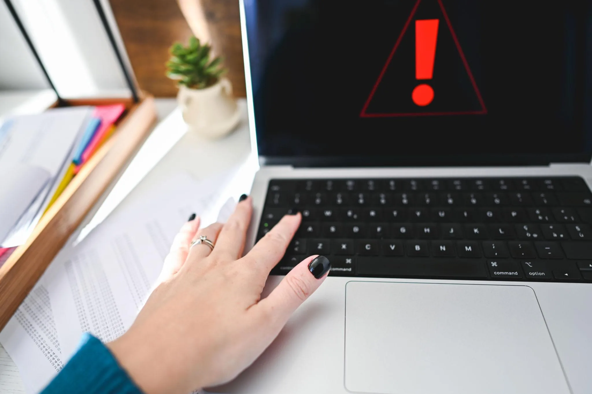 Laptop showing a critical network warning before performing a complete router factory reset